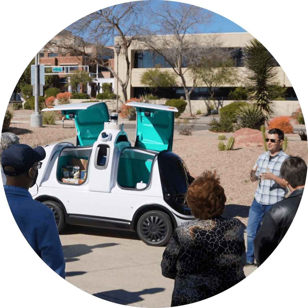 people standing around a concept vehicle