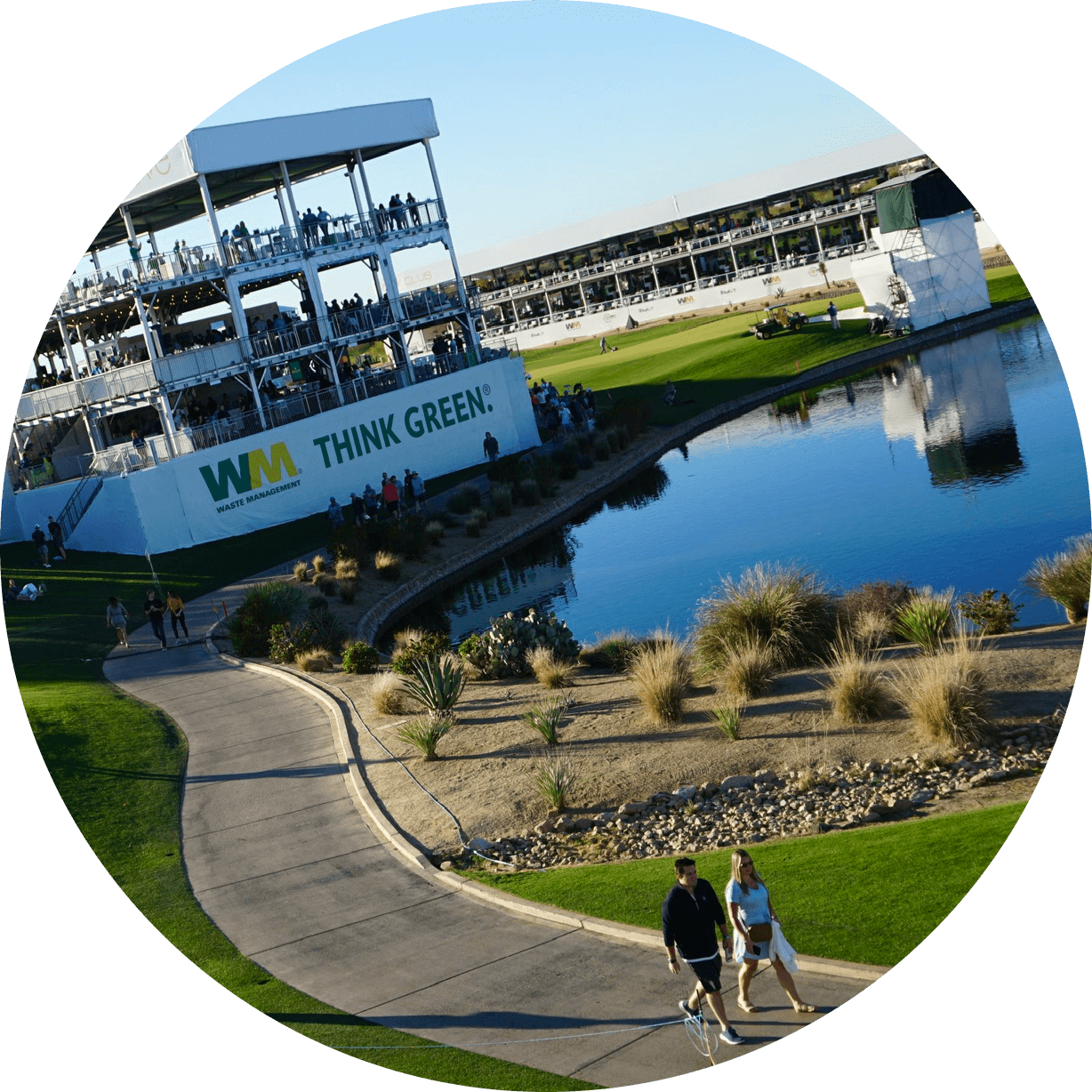 People walking around the waste management open