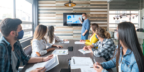 group of business owners getting training from local first