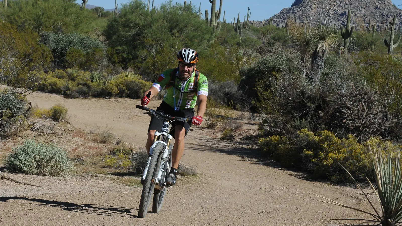 A mountain biker riding down a trail.