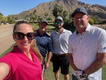 Selfie of Newbridge employee and three golfers.
