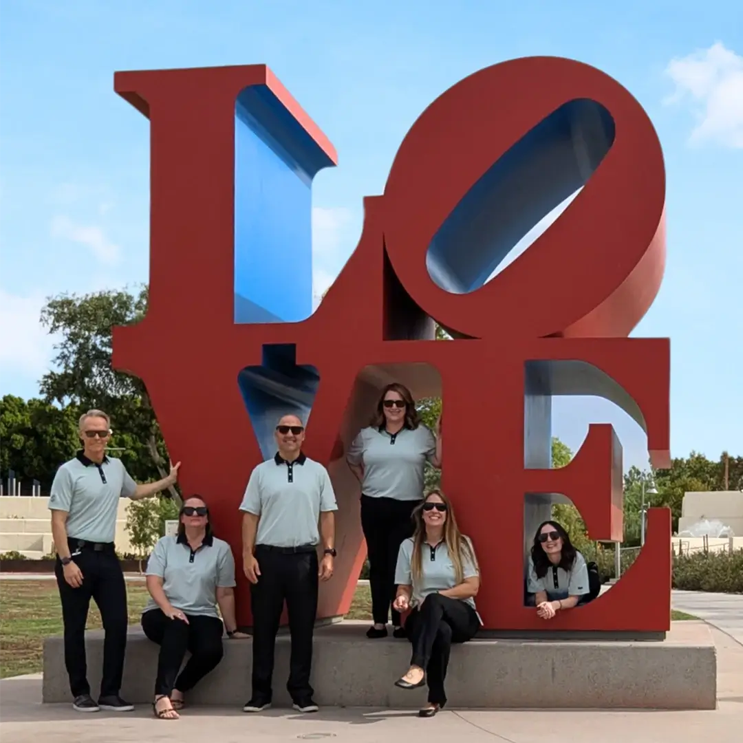 Choose Scottsdale staff photo around the Love statue.